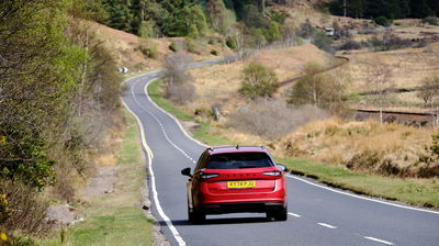 Skoda Superb Estate - rear, driving